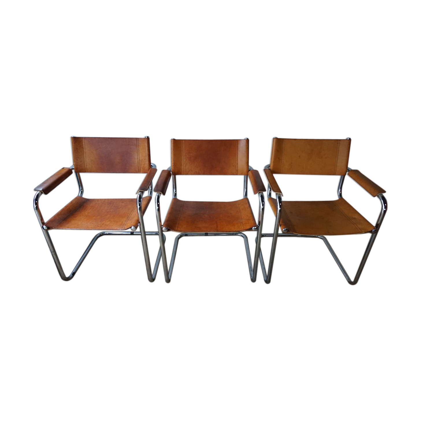 Three  leather armchairs