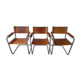 Three  leather armchairs