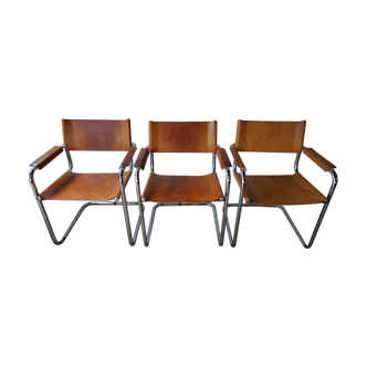 Three  leather armchairs