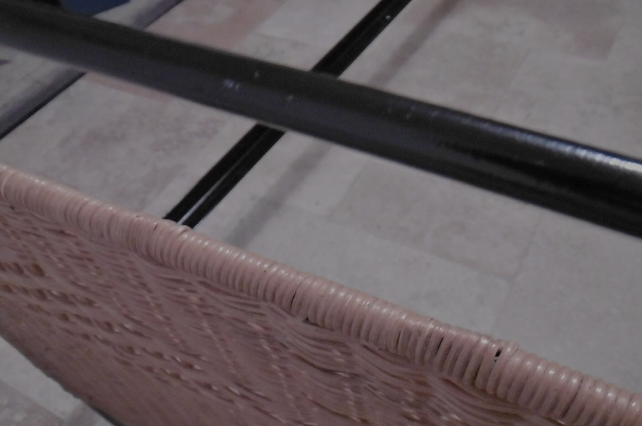 Black metal and rattan bed frame