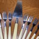 12 dessert forks and stainless steel pie shovel and ecru Bakelite handle