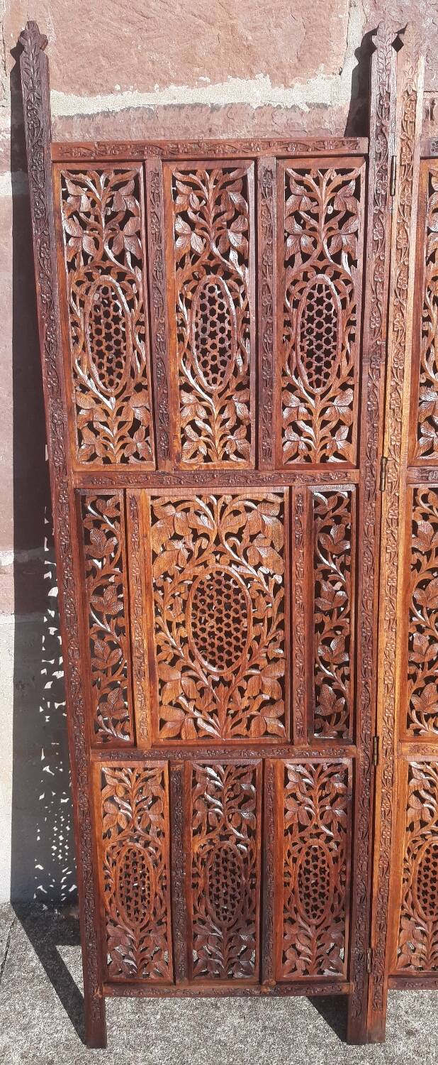 Carved solid wood screen.