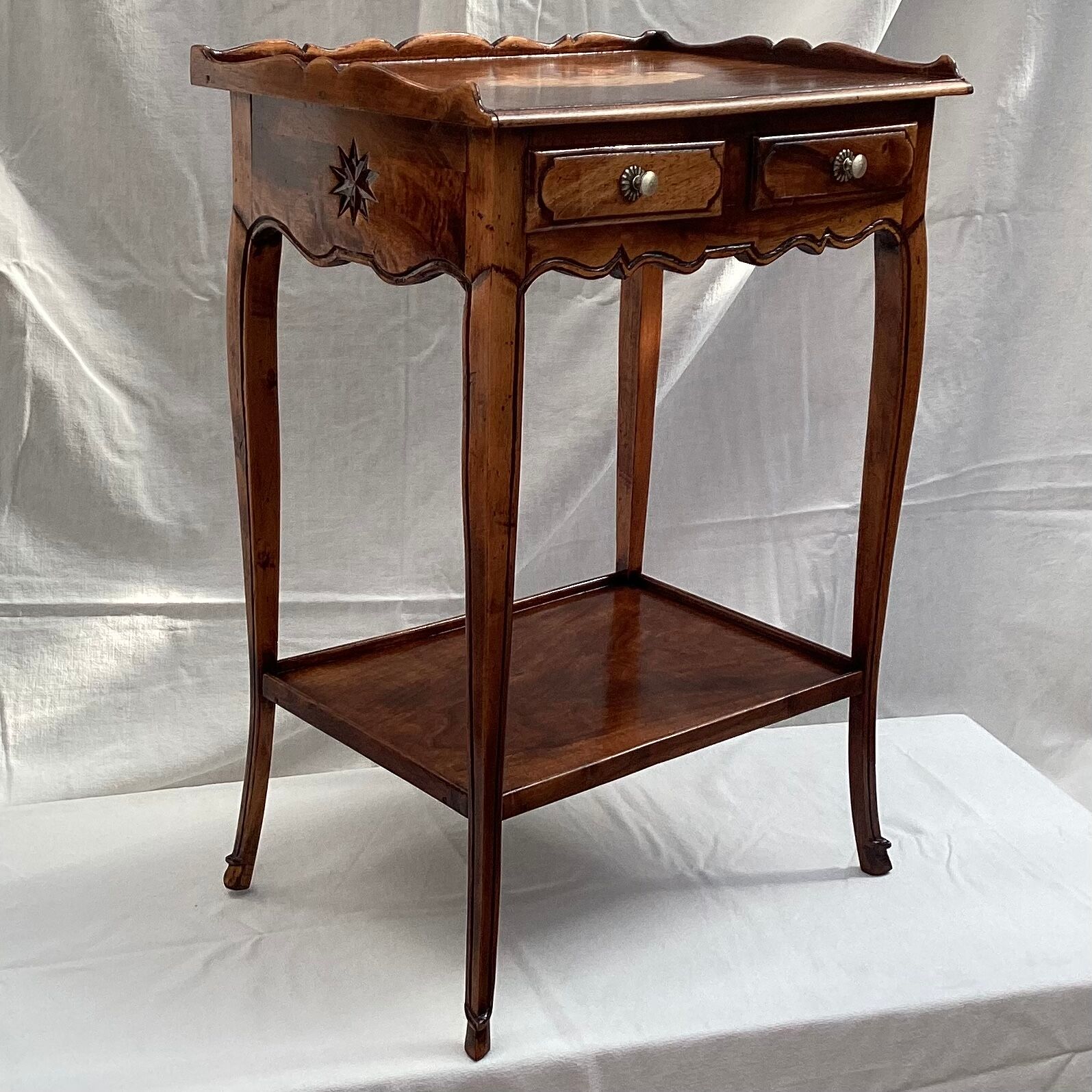 Old wooden side table with marquetry
