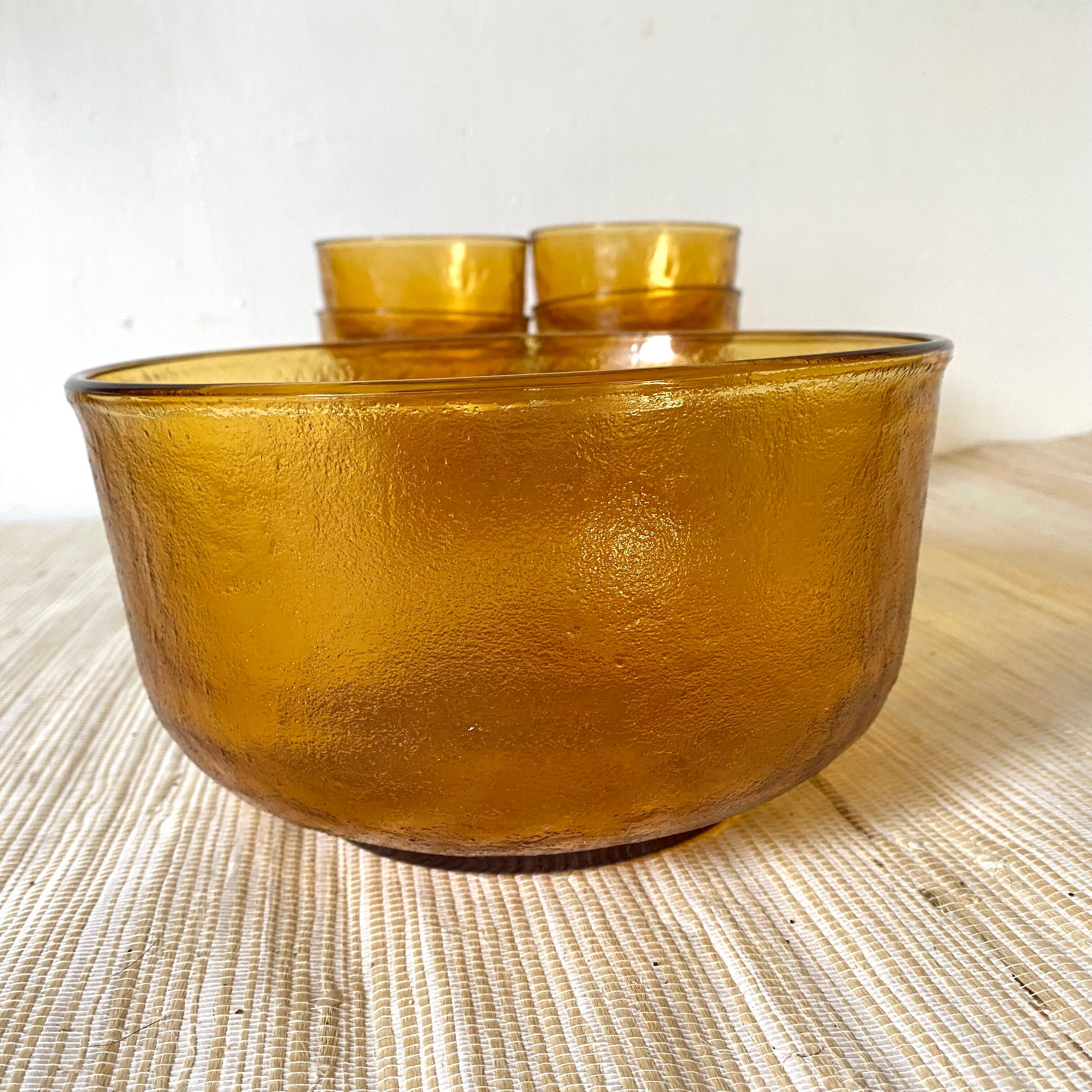 Salad bowl and bowls in amber glass, 70s