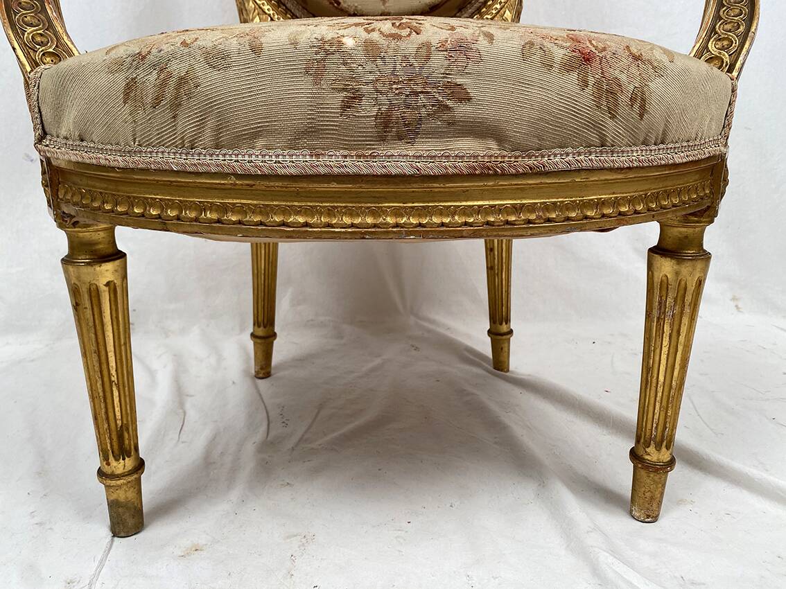 Louis XVI style gilded wood armchair, late 19th or early 20th century