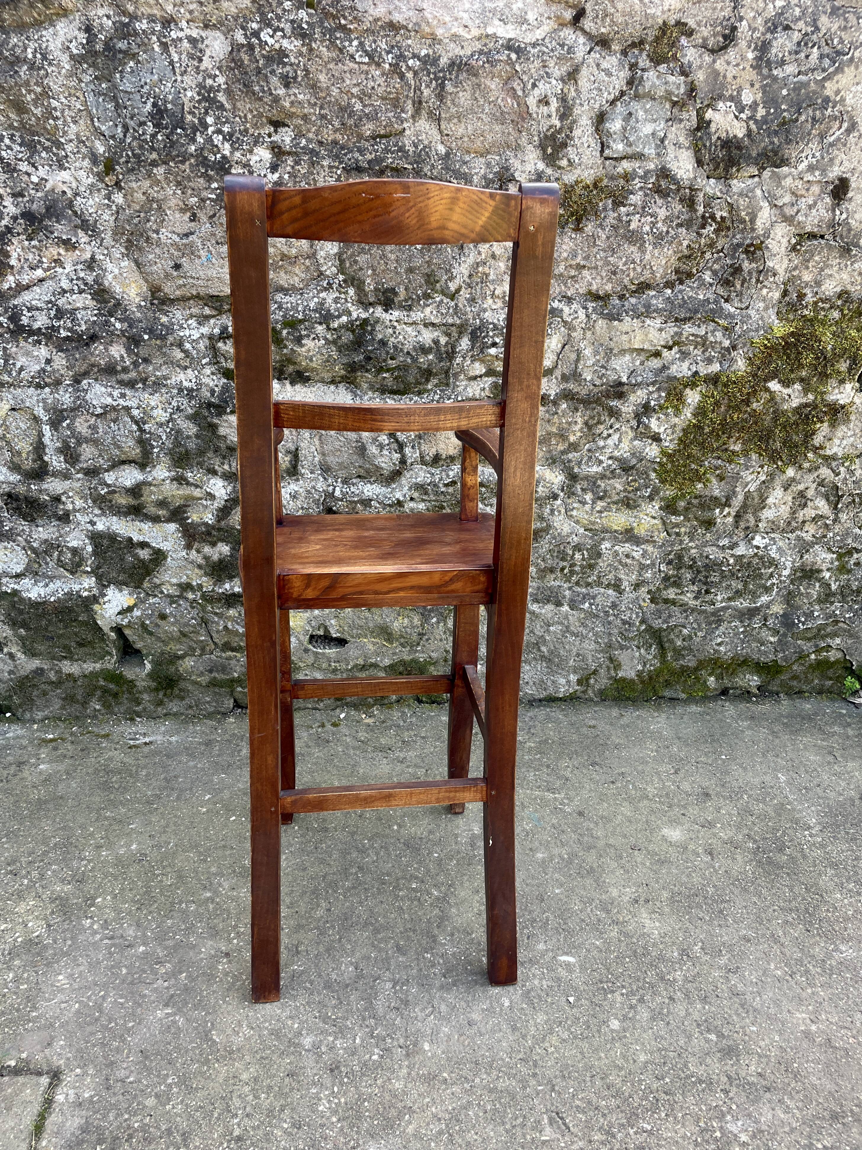 Pair of children's high chairs, early 20th century craftsmanship.