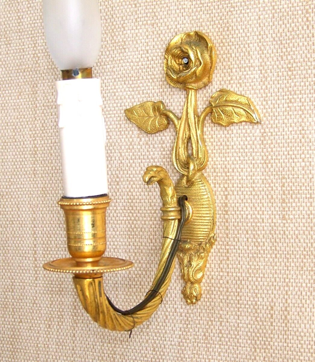 Simple wall sconce in classic Empire style made of vintage French cast brass 4316.