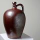 Large stoneware jar from Normandy with lustrous burgundy glaze, from the 1920s-30s.