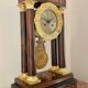 Pendule portique d'époque charles x, en marqueterie papillon et bronze doré xixe