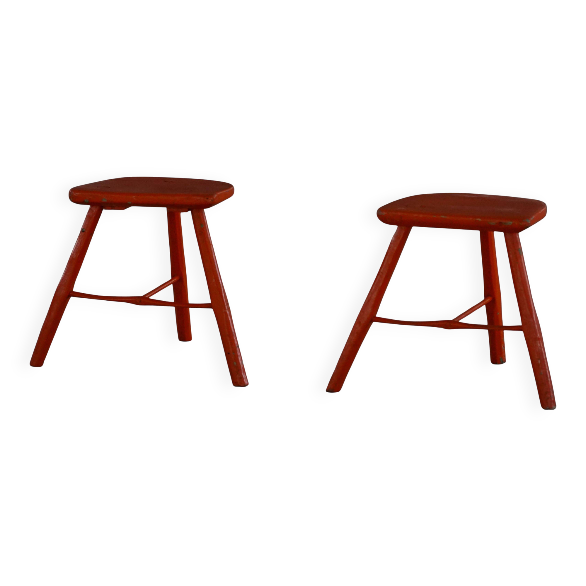Pair of patinated wooden stools painted red with flared legs, 1950s-1960s.