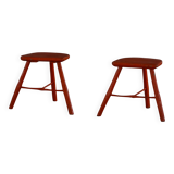 Pair of patinated wooden stools painted red with flared legs, 1950s-1960s.