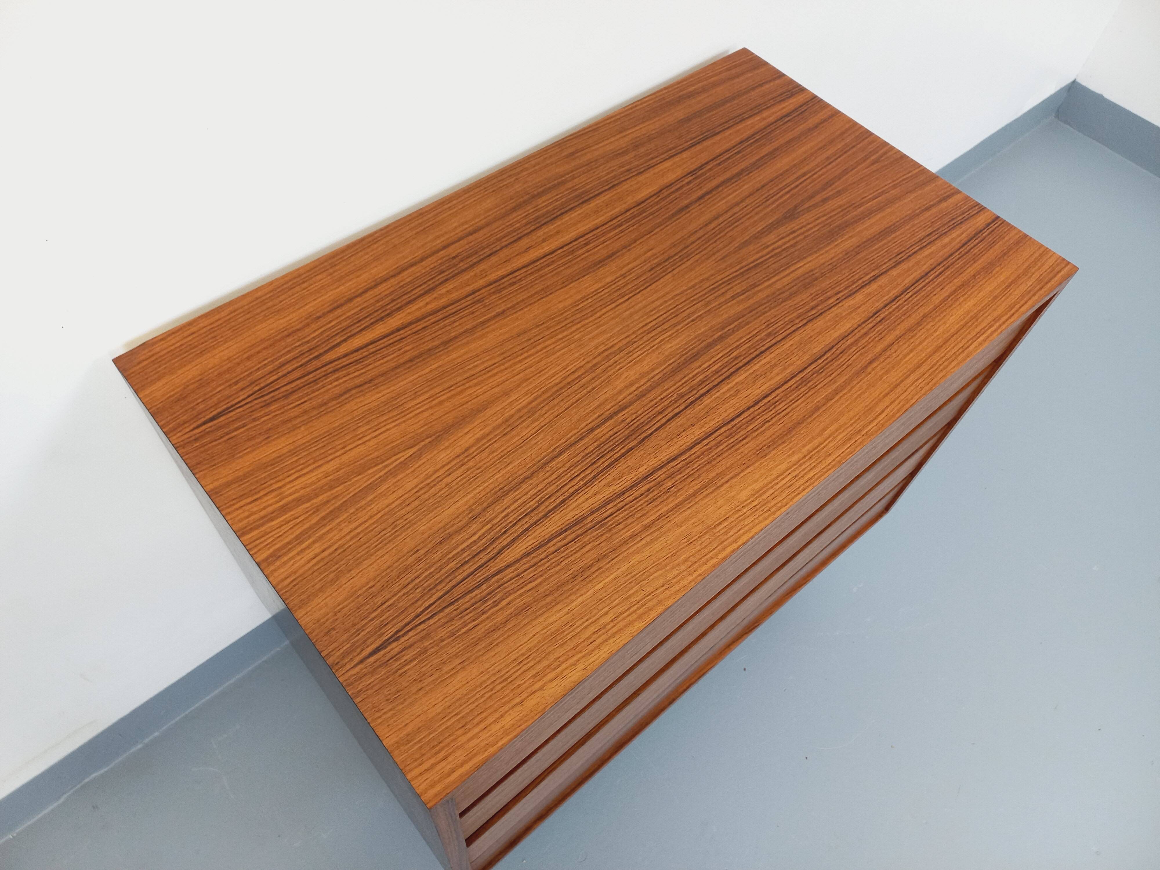 Vintage Scandinavian modernist chest of drawers in rosewood and black metal.