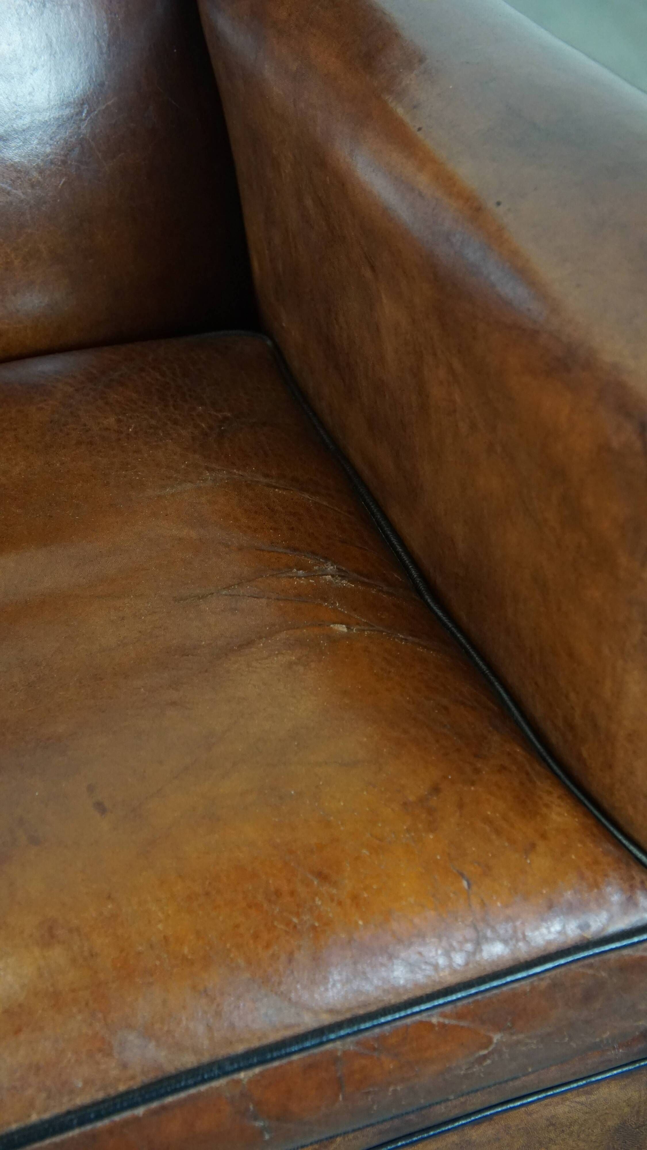 Cognac-colored sheep leather Art Deco design armchair finished with piping