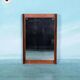 Minimalist Scandinavian mirror in teak with a vintage design.