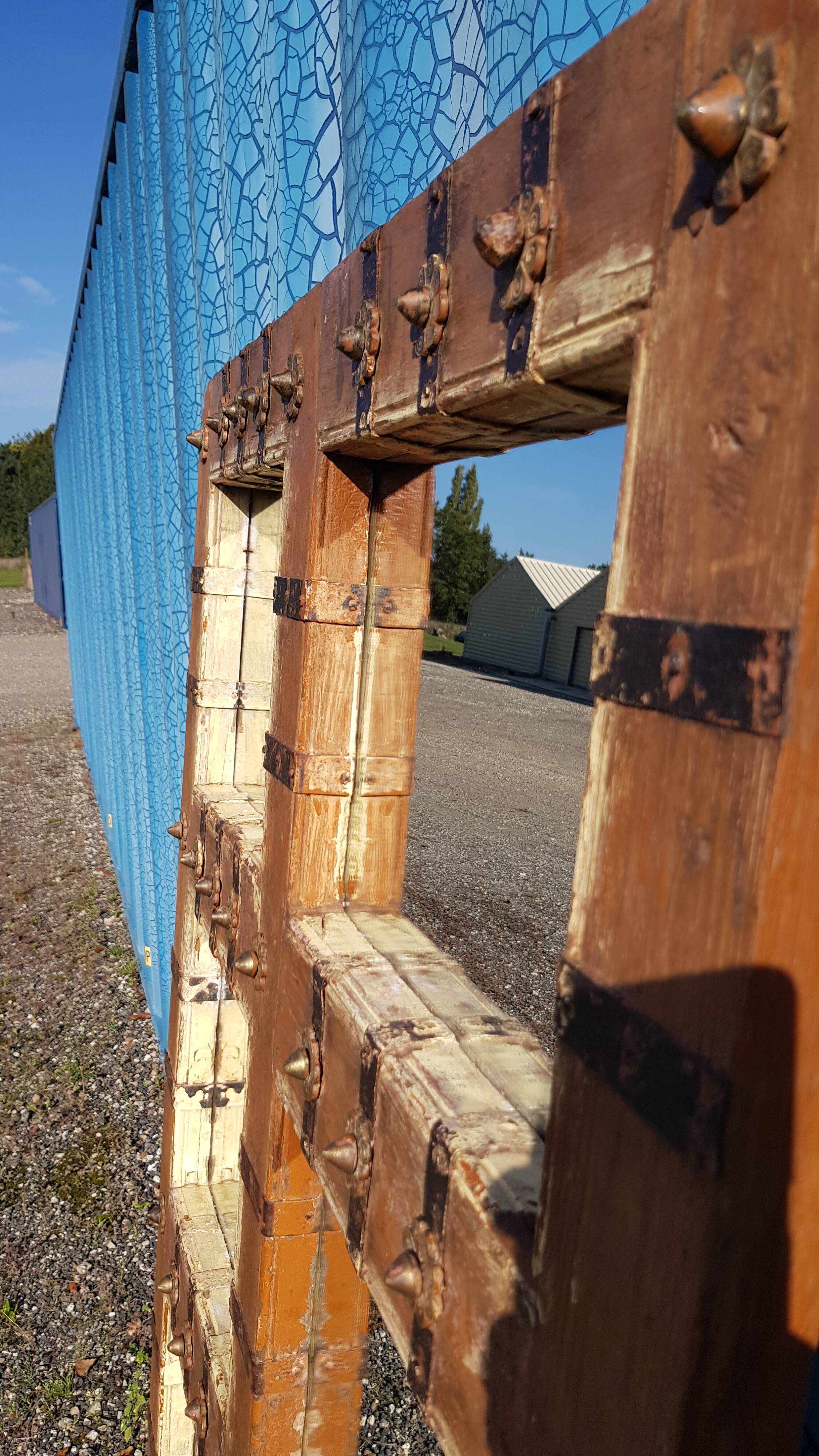 Old Burmese teak mirror with copper fittings