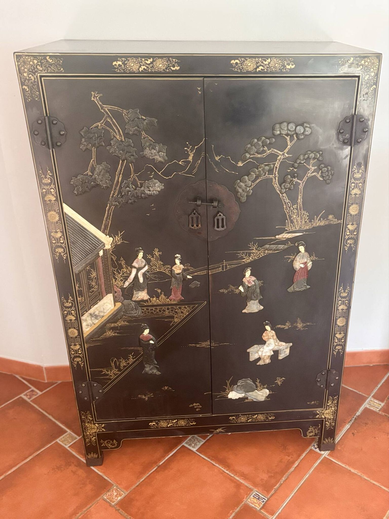 Magnificent black and gold lacquered Chinese cabinet.