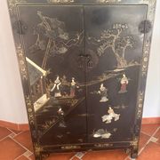 Magnificent black and gold lacquered Chinese cabinet.