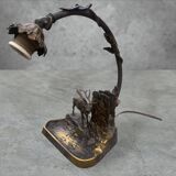 Metal table lamp with a deer on the front