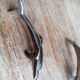 Set of three silver metal dolphin place markers