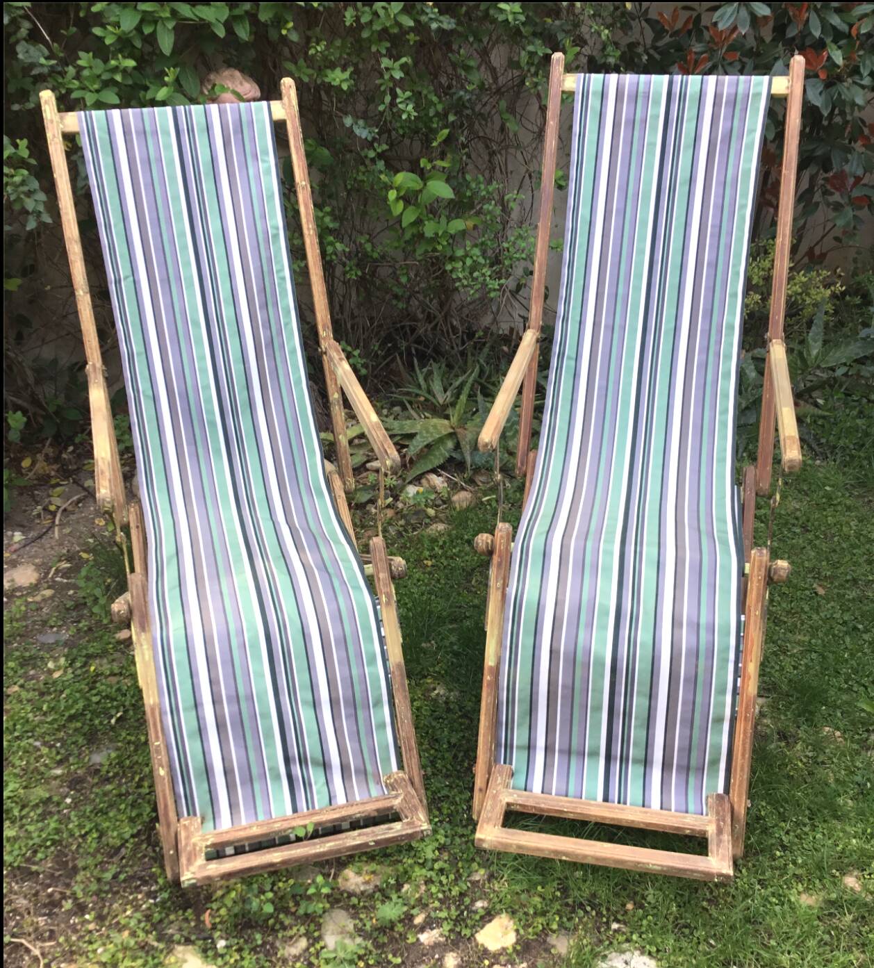 Pair of 19th-century wooden deck chairs with pegged frames and wrought iron