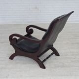 1970s, vintage armchair with footstool, black furniture leather.