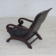 1970s, vintage armchair with footstool, black furniture leather.