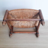 Low wooden stool and straw