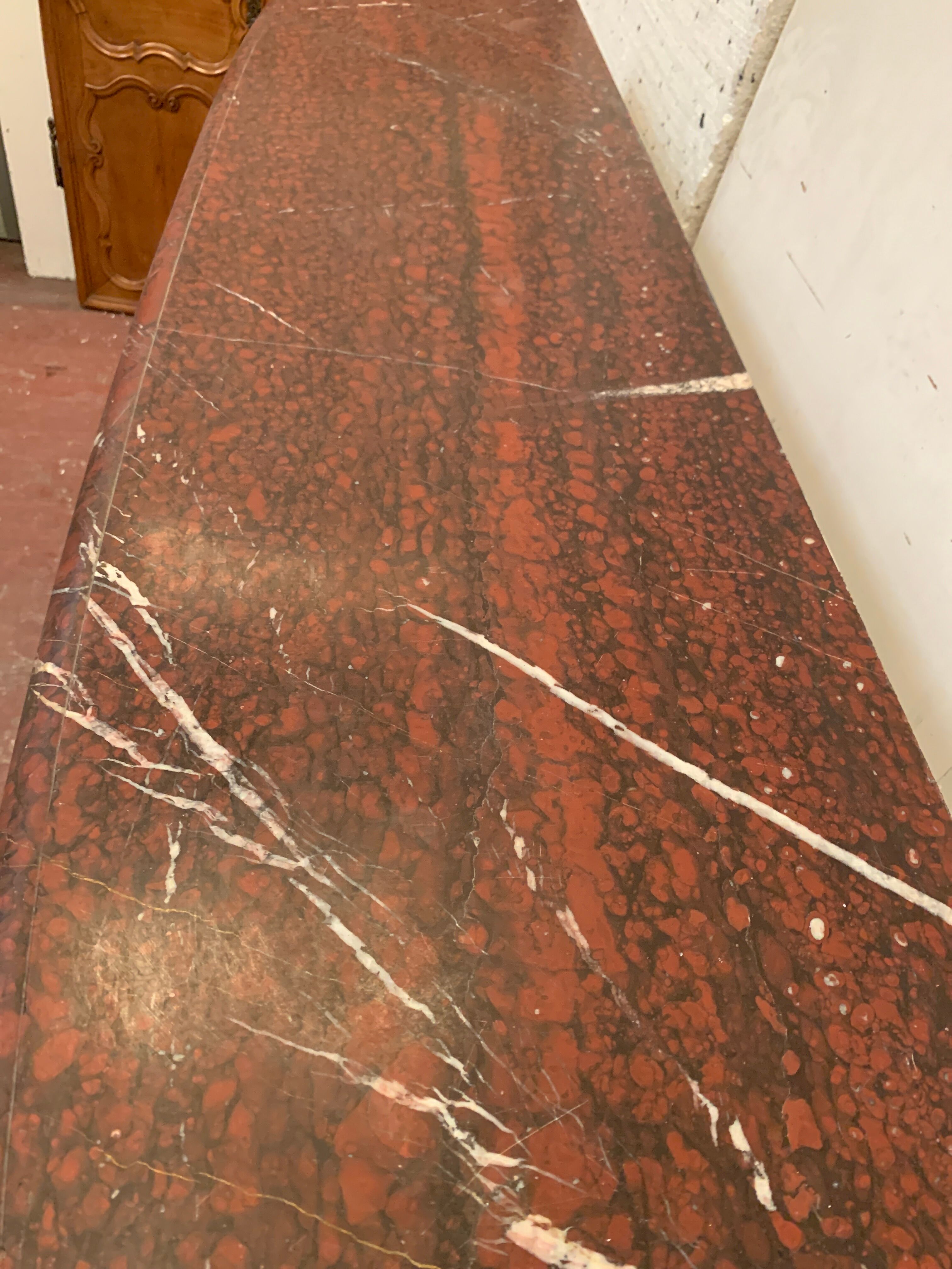 Pair of Louis XIV style fireplaces in red cherry marble. XIX century.