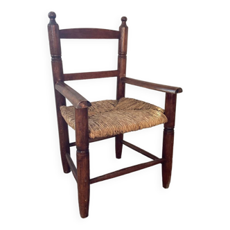 Vintage wooden armchair and straw seat for children