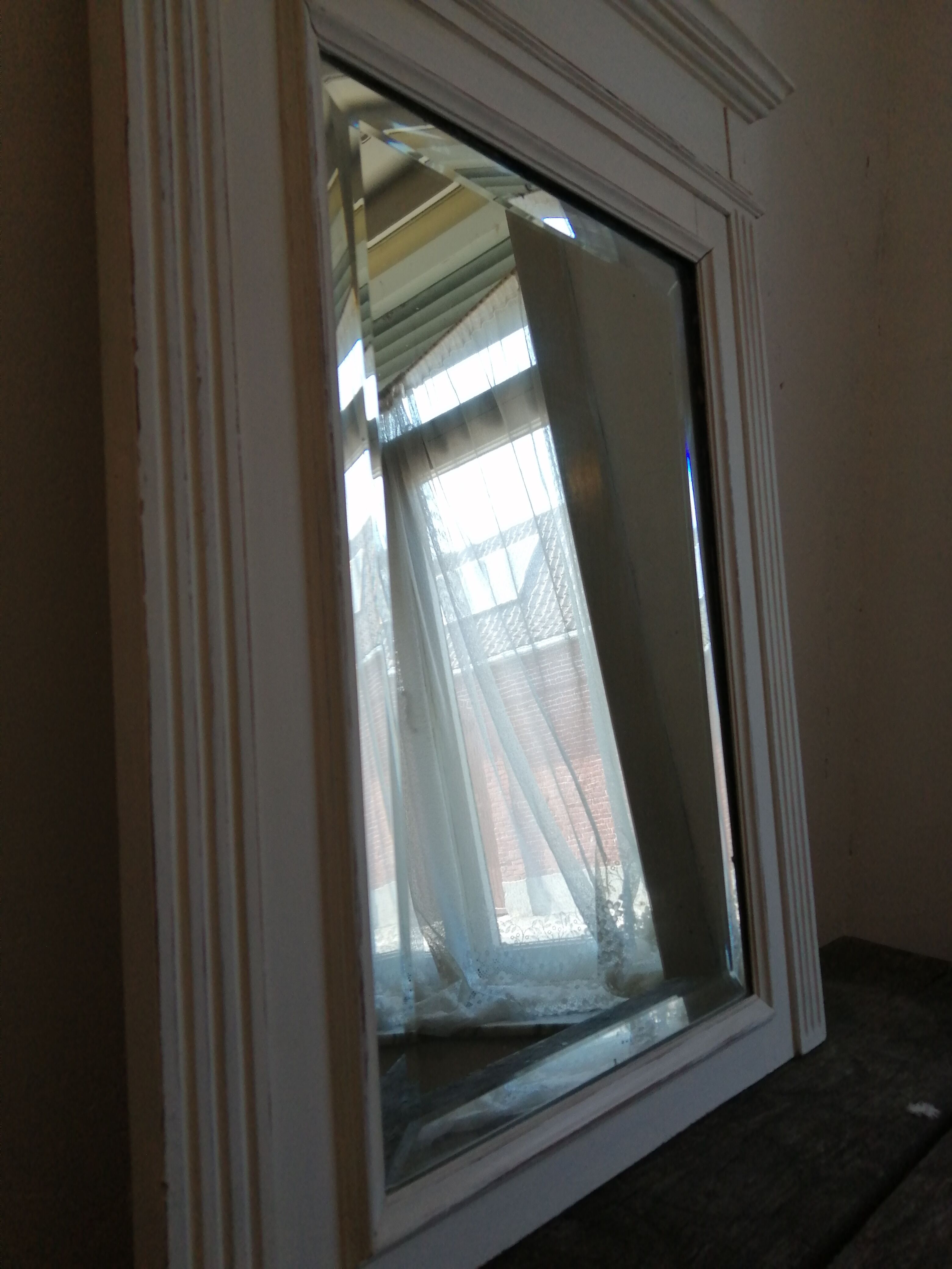 Beveled fireplace mirror