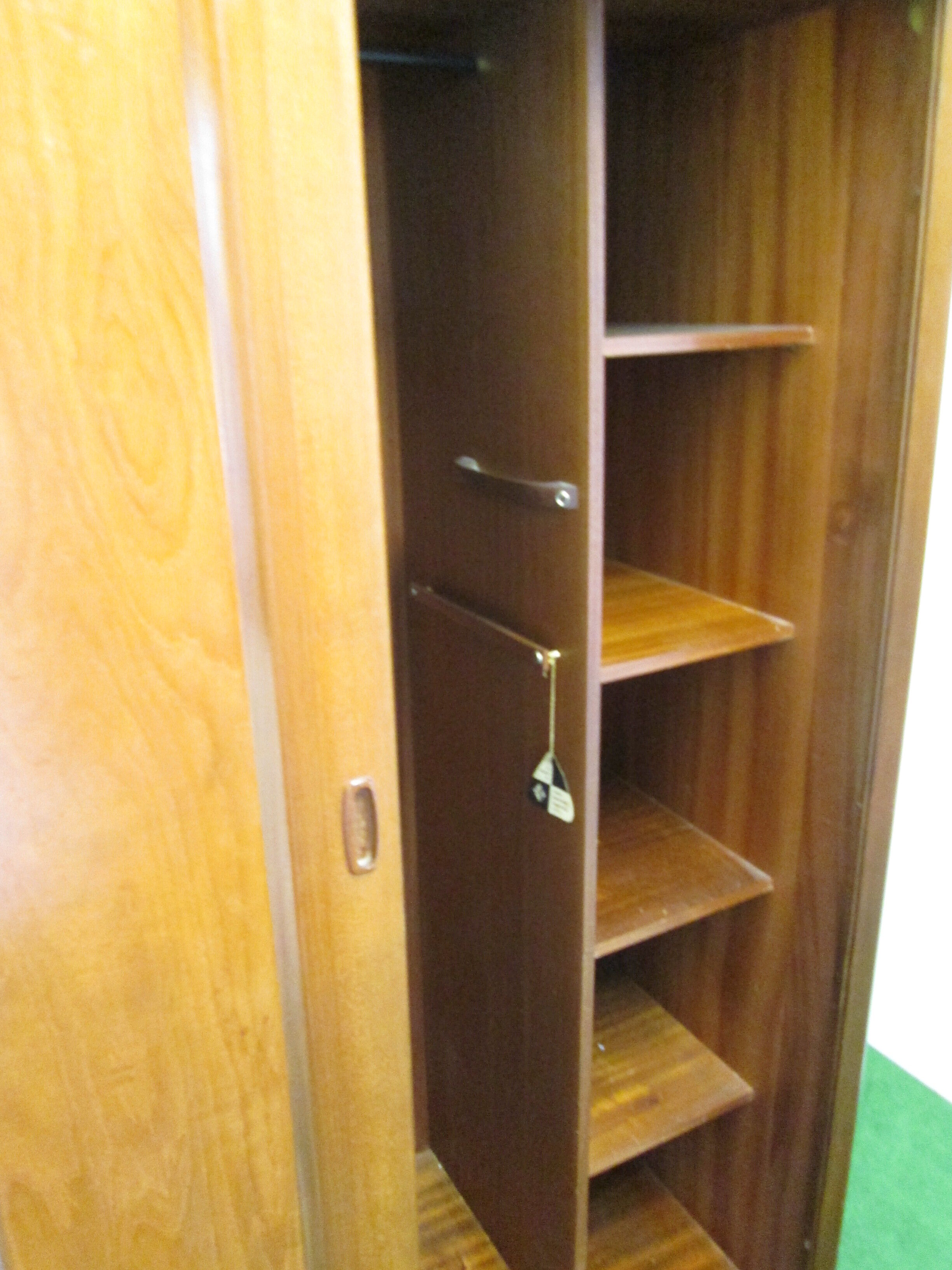 Teak cabinet with shuttered sliding door