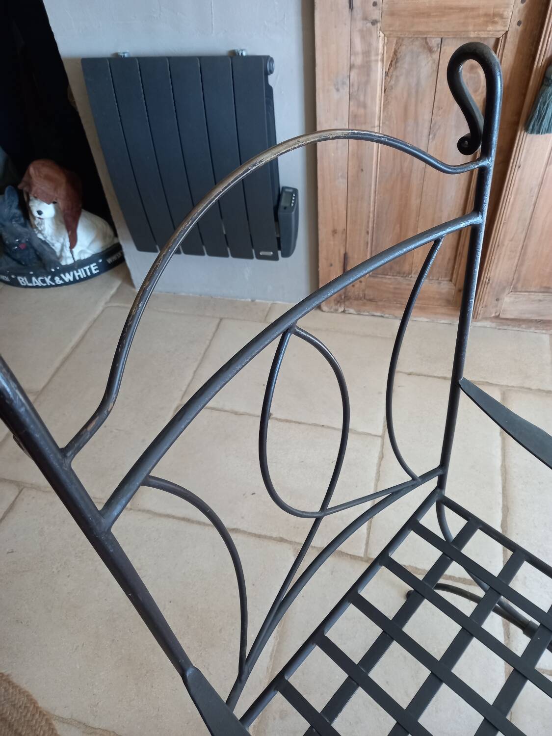 Glass table and wrought iron chairs