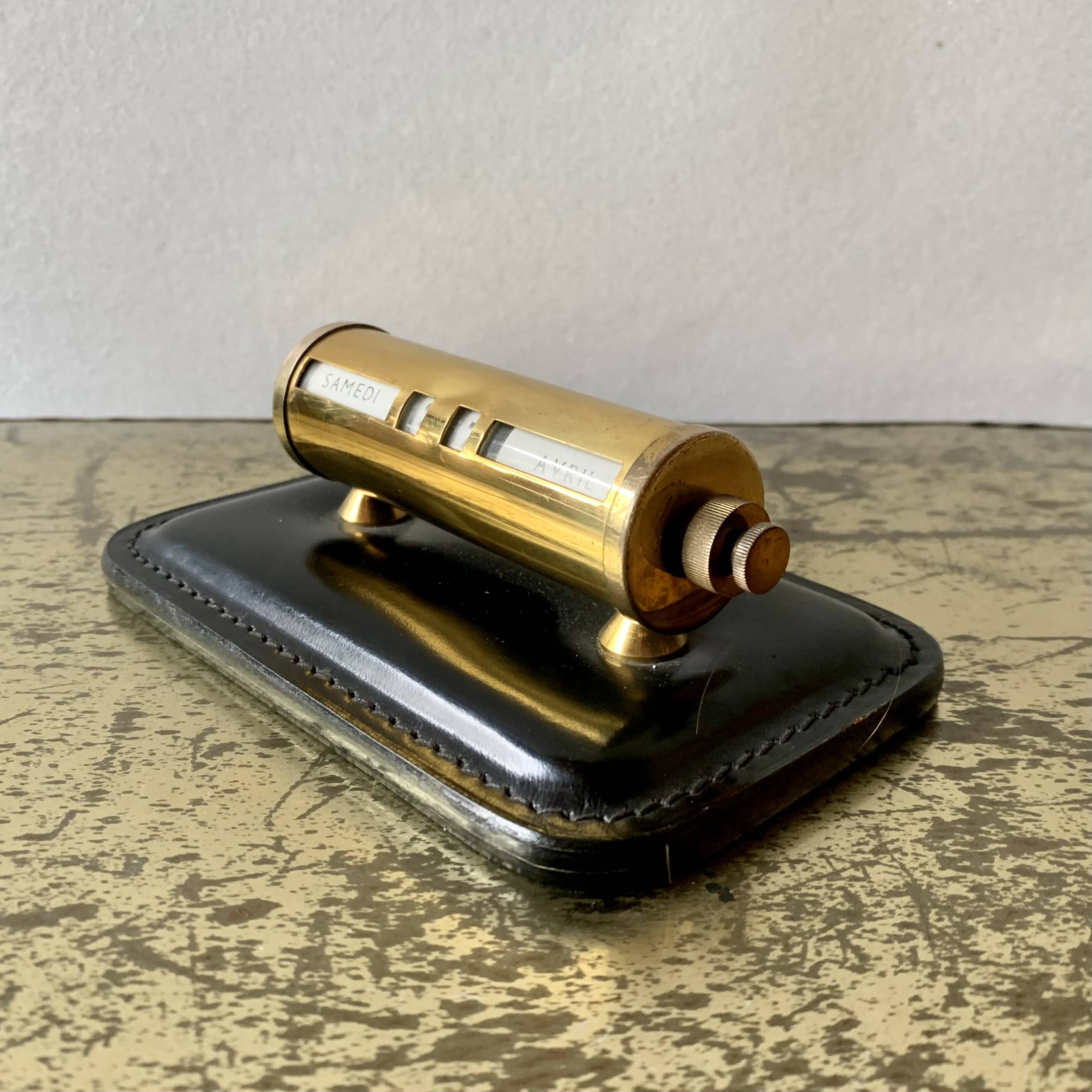 Old perpetual calendar in leather and brass
