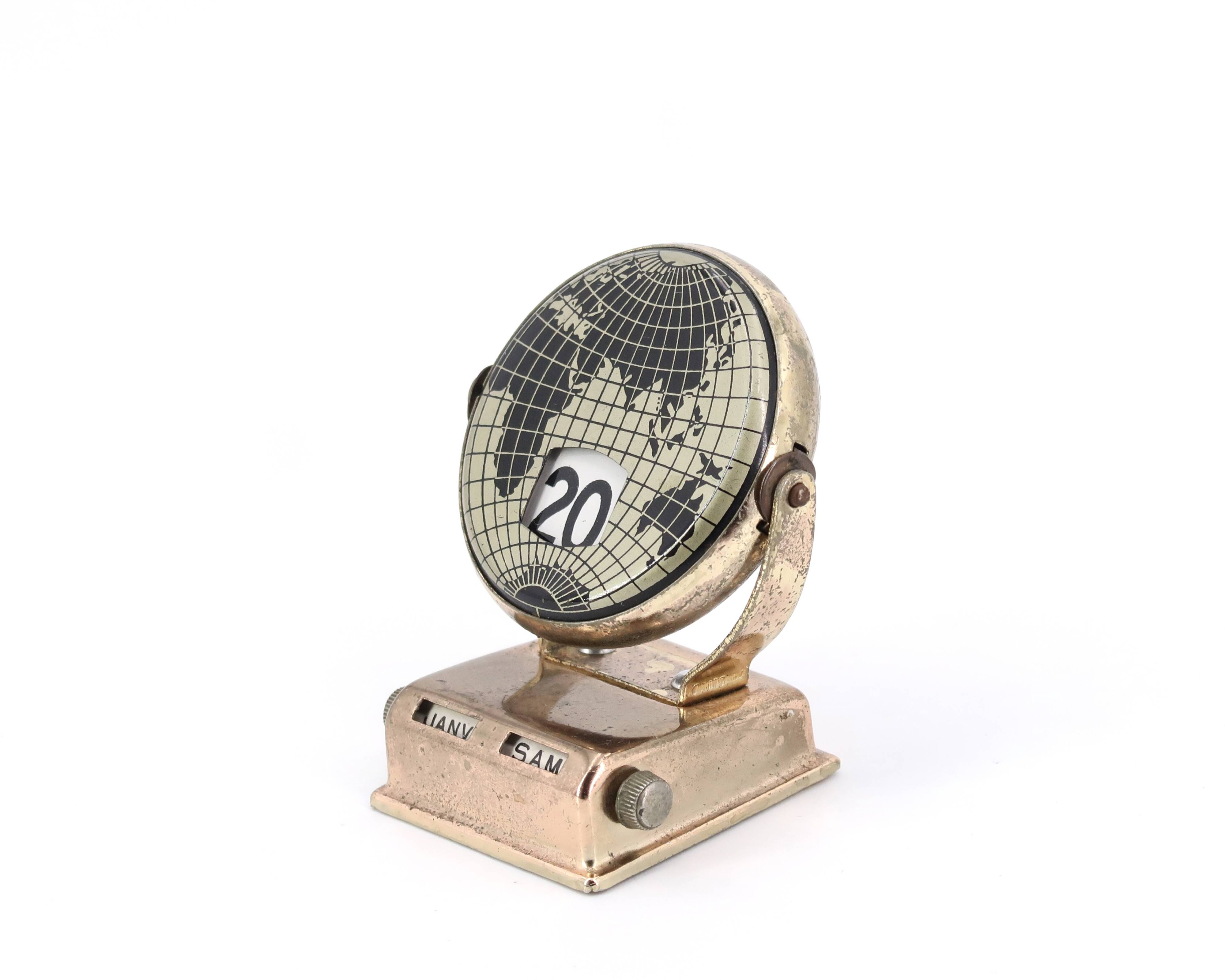 World map perpetual calendar paperweight, 1950s