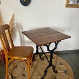 Bistro table with iron legs and raw wood top
