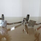 Pair of chrome metal coat hooks from the 1970s.
