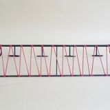 Minimalist wall coat rack in string design in black and red