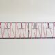 Minimalist wall coat rack in string design in black and red