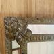 Small mirror with repoussé brass frame.