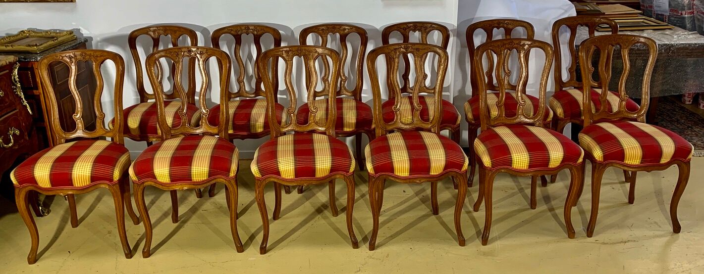 12 chairs in oak, carved wood with fleurette decorations, fabric seat