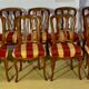 12 chairs in oak, carved wood with fleurette decorations, fabric seat