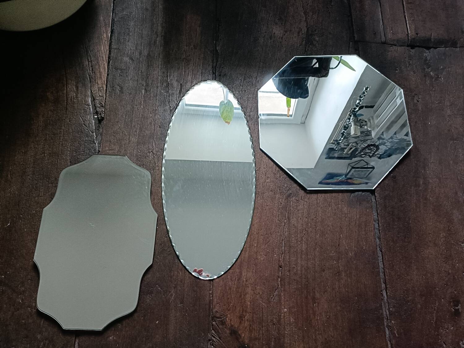 Three beveled mirrors