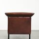 Sleek sheepskin Art Deco design armchair with black piping