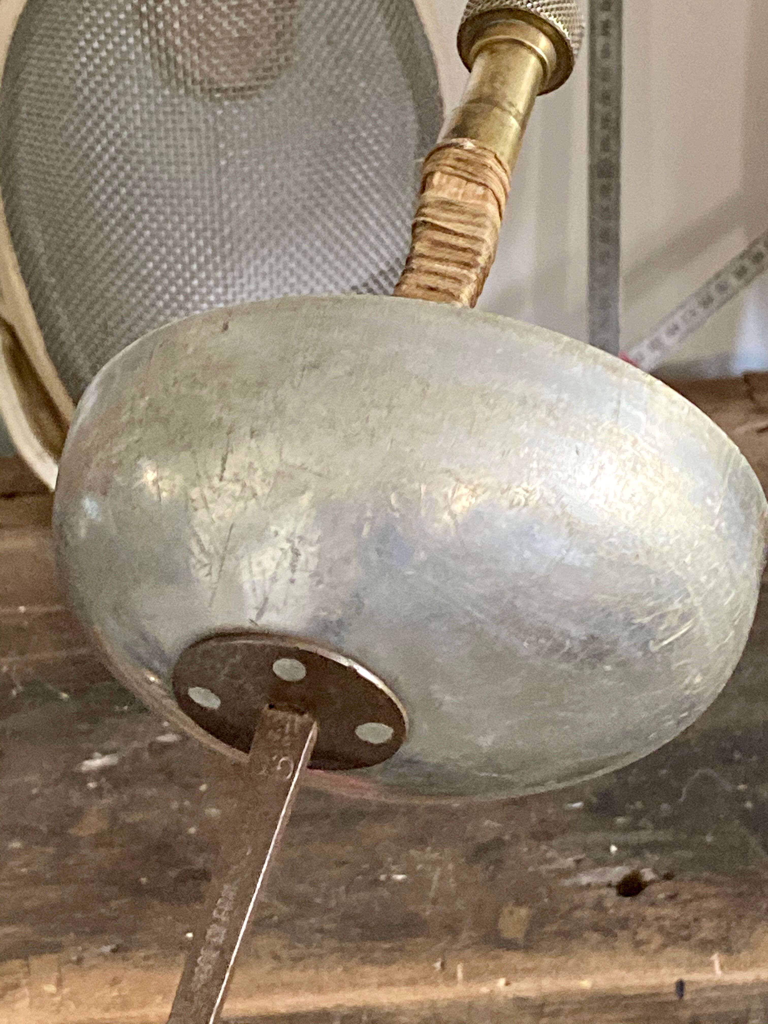 Old fencing mask set and its foil