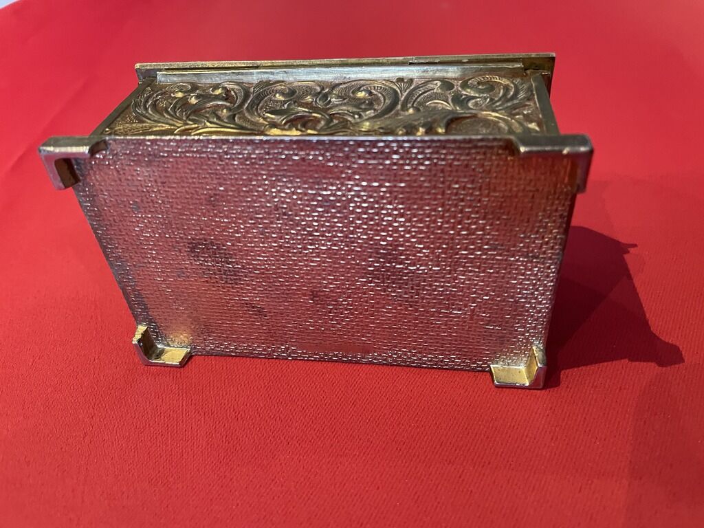 Ancient box made of chiseled metal and stone