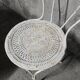 Antique painted wrought iron garden furniture, round table and four chairs.