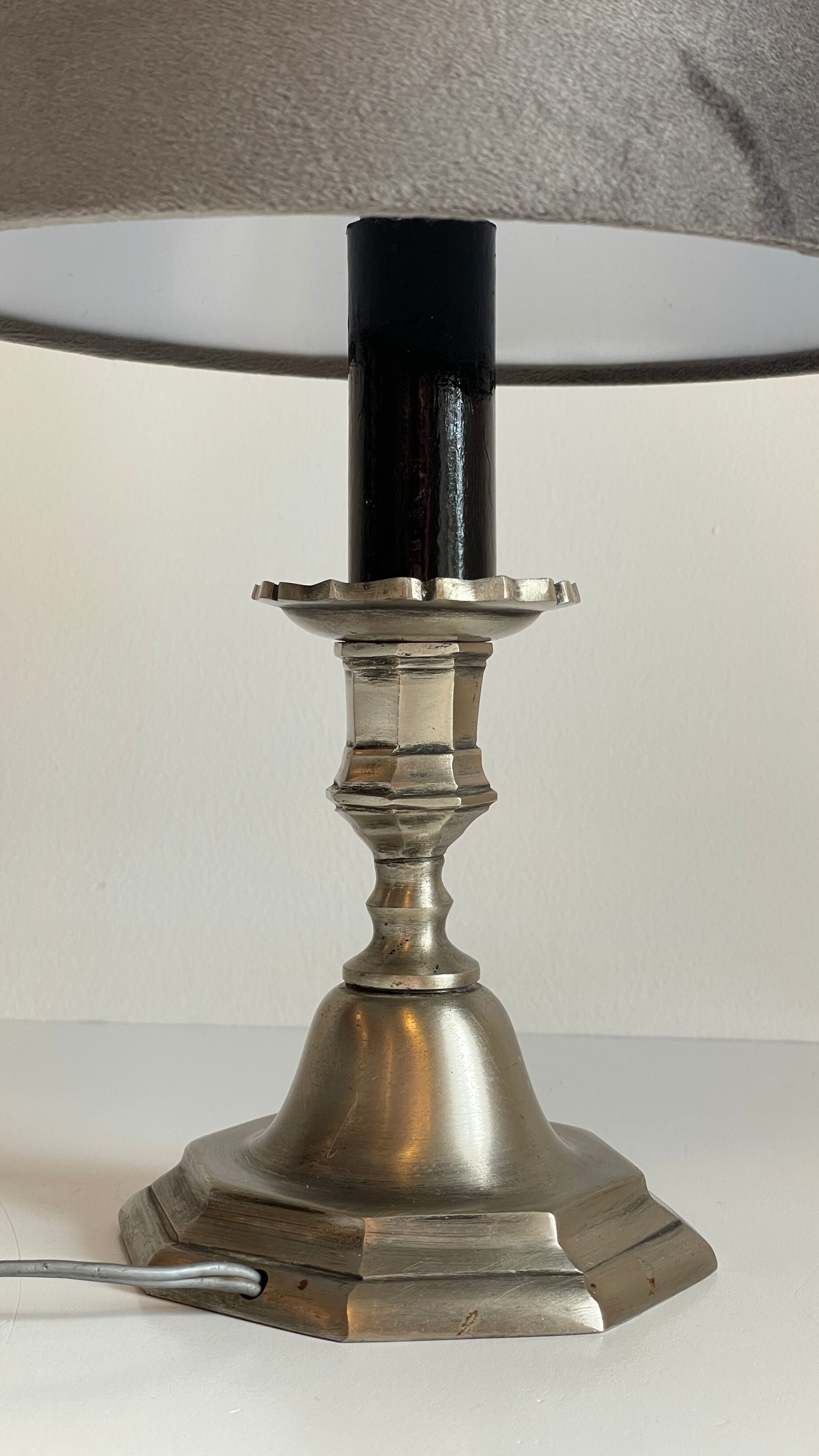 Steel candlestick lamp and grey velvet