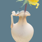 Old decorative carafe in li-colored glass