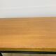 1950s modernist coffee table, wood and black metal.