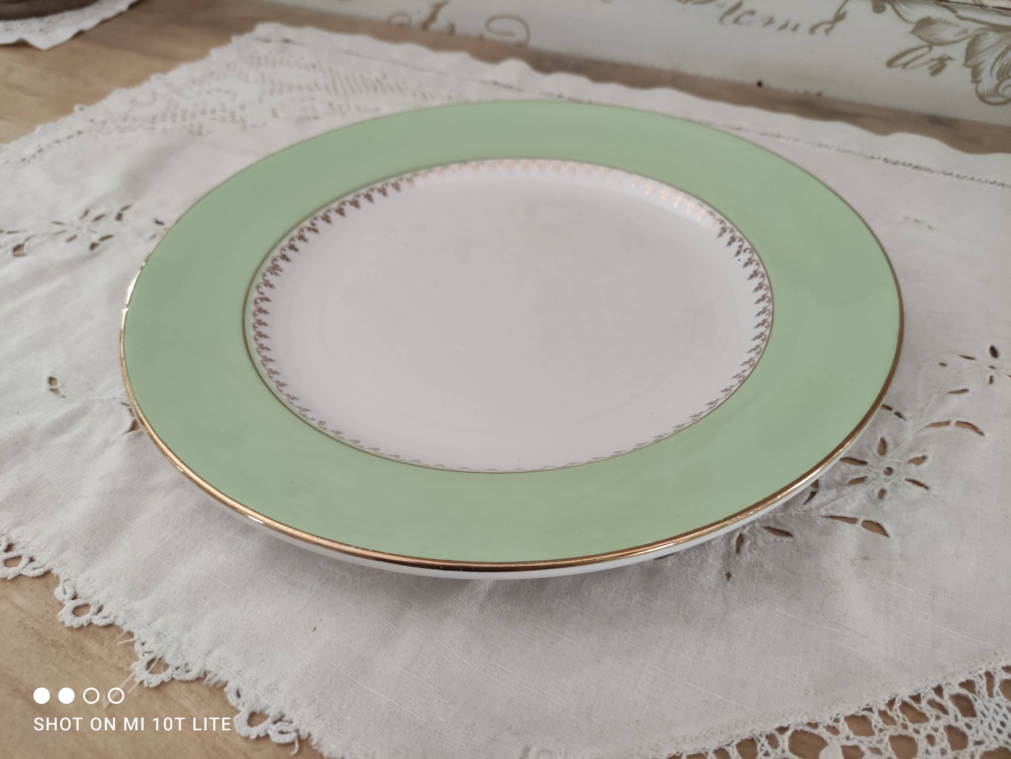 Round plate with aqua green rim and golden frieze, Cafés Lemaire.